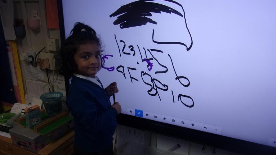 Sanaya is writing her numbers on the board