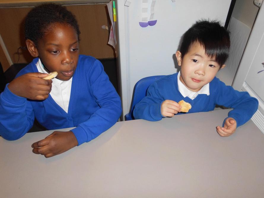 Adedolapo and Aaron eating a love heart biscuit