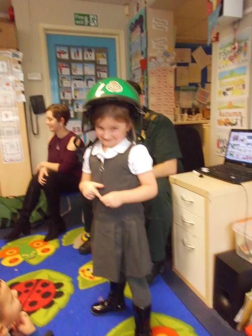 rosie trying on the green helmet