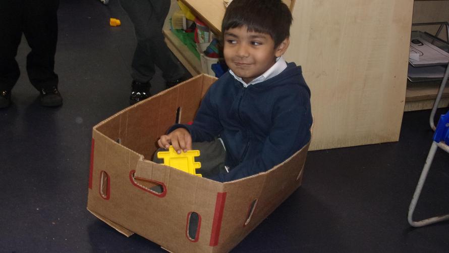 Armin chose to make the box into a ship with a steering wheel. 