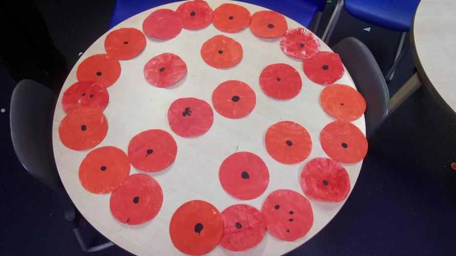 RD have been making poppies by painting and using a thumbprint. 