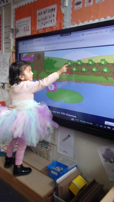 The Rainbow Fish (Sanaya) practising her maths skills!