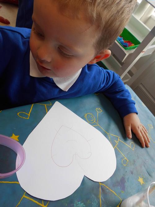 Harry drawing a love heart