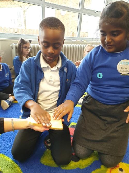 Hand sanitiser hands on fresh bread.