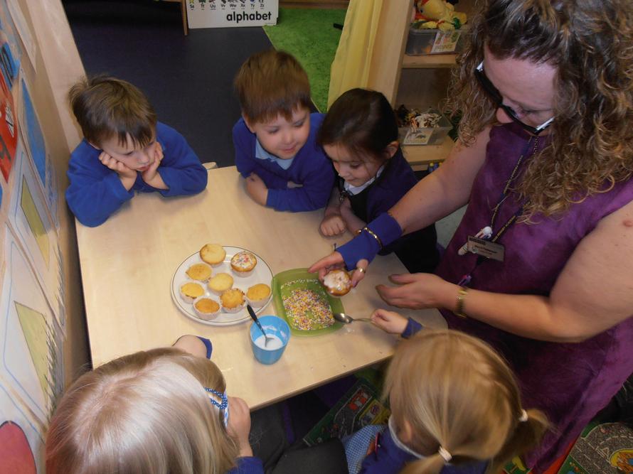 Icing our cakes ready to eat them! Mmm!