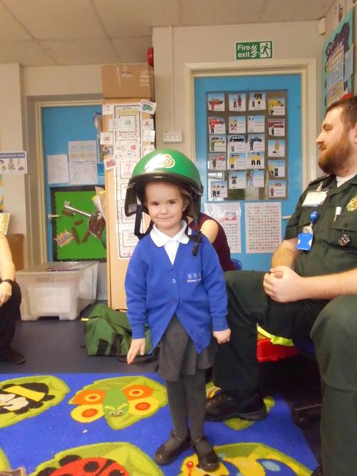 Trying the green helmet on