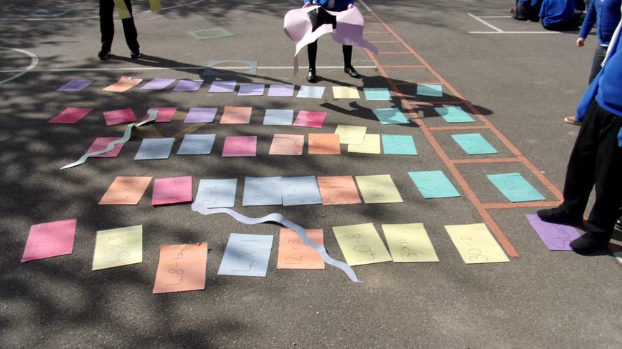 Giant snakes and ladders maths game. 