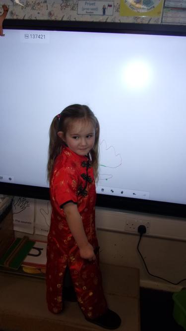 Dressing up in traditional Chinese clothing.