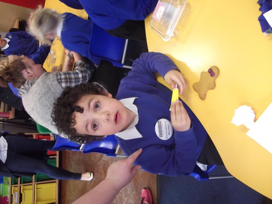 Yusuf and his biscuit! He decorated it for mum.
