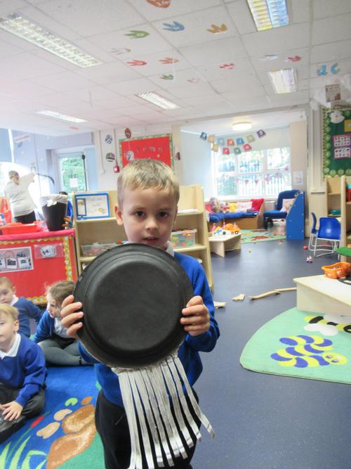 Iustin with his shaker he made at home with his book pack activity!