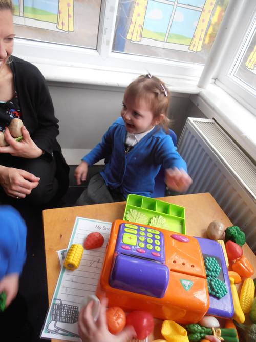 Role play with the till in the Vegetable shop