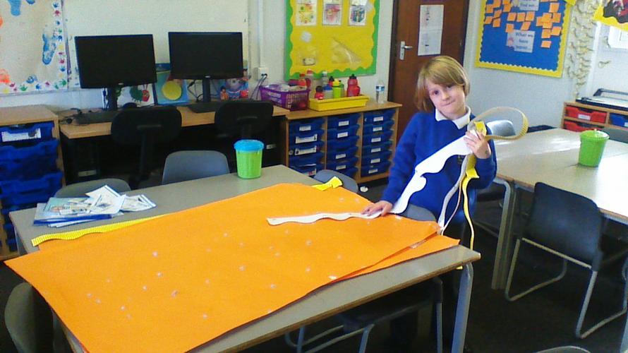 Maisie helping Miss Arnott with the display